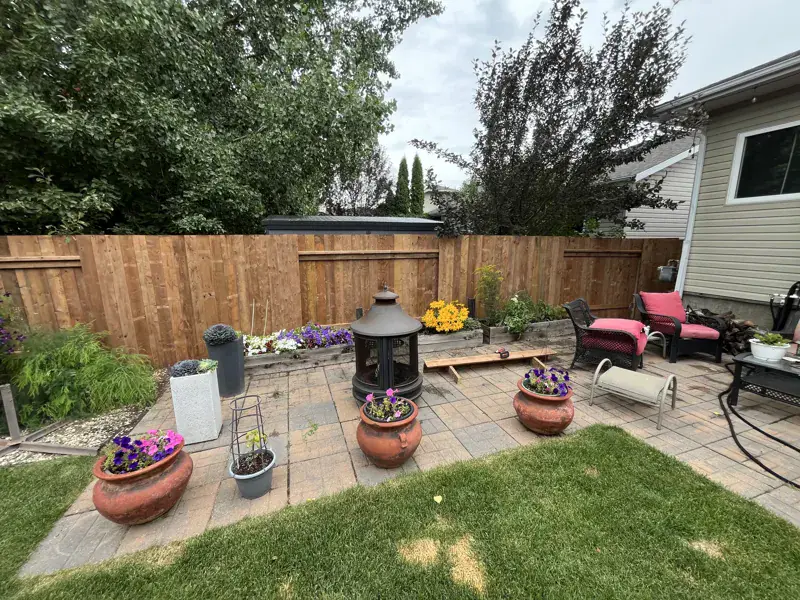 Backyard patio with a new cedar fence